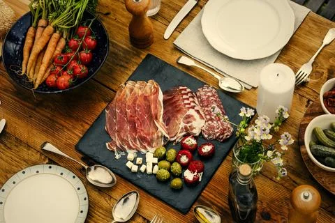 Dinner table set in the garden Stock Photos