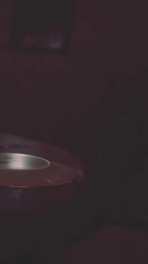 Dinner table with soft lighting and a round plate set for a meal Stock Footage 342652760