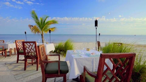 Dinner Table on Tropical Beach Stock Footage