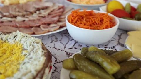 A dinner table with various dishes, Ukrainian folk dishes, salads, etc. Stock Footage 219329516