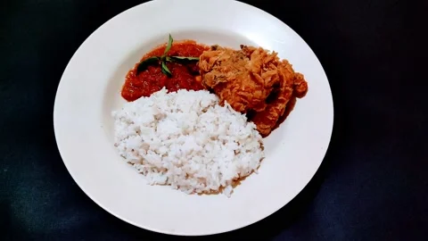 Dinner with: white rice, crispy chicken, chili sauce Stock Footage 204112673