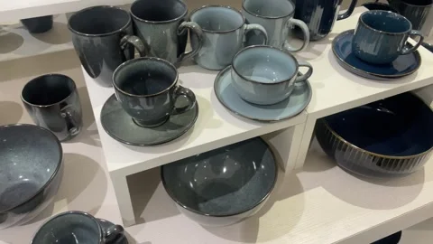 Dinnerware Set Stylish Blue and white biege Cups, Bowls, and Plates Video stock 320410758