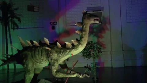 Dinosaur biped spikes animatronic doll statue animal prehistoric Stock Footage 335873749