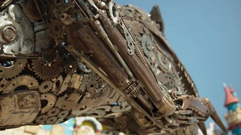 Dinosaur made of cogs and metal parts scuplture. Shot on RED Raven Stock Footage 105855804