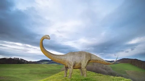 Dinosaur in a mountain landscape - clouds pass by in time lapse - loop Stock Footage 145721170