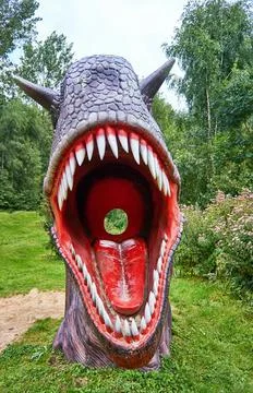 Dinosaur mouth with sharp teeth. Insert a hole in the middle of the head to t Stock Photos