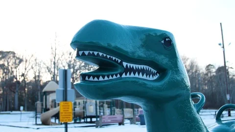 Dinosaur Spring Rider at Playground in Winter Stock Footage 98007731