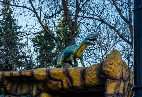 Dinosaur Statue on Rock Fotos Stock
