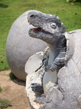 Dinosaur statue in theme park Stock Photos