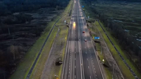 Diode lighting over the road and sidewalk at dusk. Rush Hour Rhythm on a Country Video stock 257778090