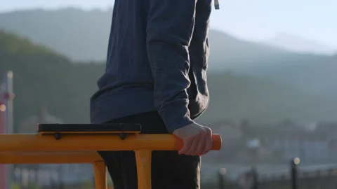 Dip bar exercise on outdoor workout equipment 動画素材 150001093