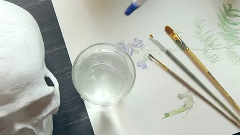 Dip the brush into the water. Brush for drawing with blue colour Stock Footage 76465882