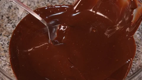 Dip the profiteroles in the chocolate Stock Footage 97940837