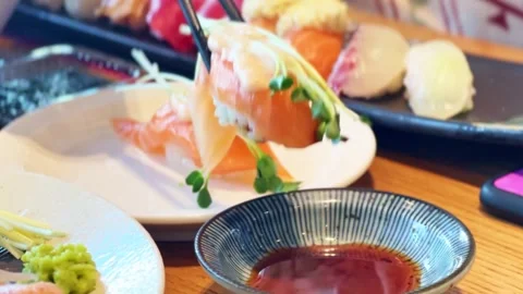 Dip sushi in soy sauce Stock Footage 296536668