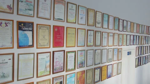Diploms &amp; Awards Hang on the Wall Video stock 36582034