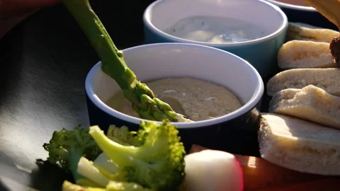 Dipping asparagus in sauce Chef preparing mixed grilled seafood platter - 動画素材 316099677
