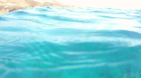 Dipping below the surface of the water to see people snorkeling Molokini crater Video stock 41341960