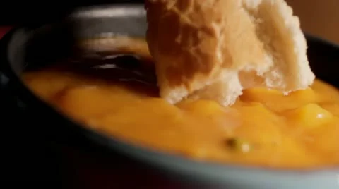 Dipping Bread into hot soup Video stock 11976444