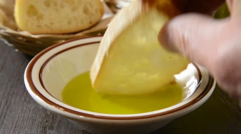 Dipping bread in olive oil Stock Footage 51268017