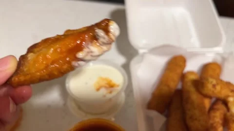 Dipping Buffalo Chicken Wings Into A Ranch Dressing Dip Sauce Video stock 295569904