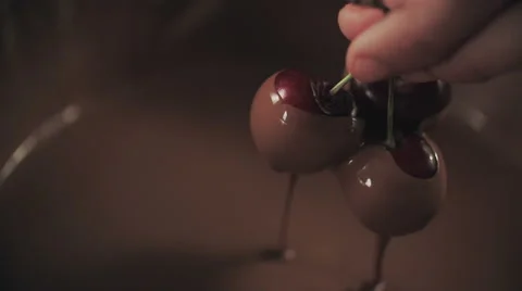 Dipping Cherries into Melted Chocolate Stock Footage 51598053