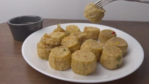Dipping chicken roll into sauce. 動画素材 276976735