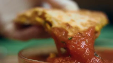 Dipping Crispy Quesadilla into Red Salsa — Overhead View Stock Photos