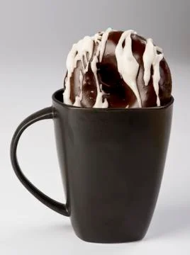 Dipping Donuts. Stock Photos