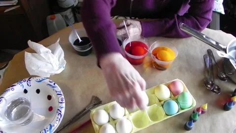 Dipping Egg Into Blue Dye Stock Footage 150267413
