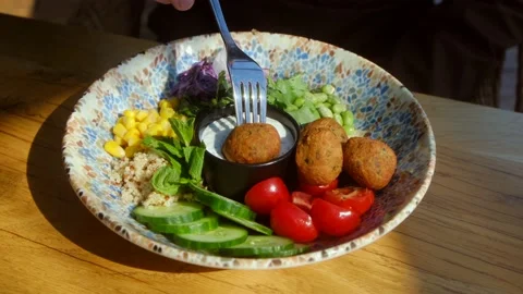 Dipping falafel in sauce Video stock 238851024