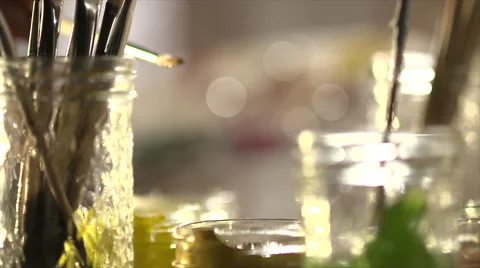 Dipping paint brush into paint Stock Footage 56237872