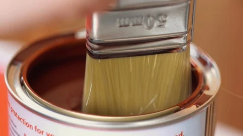 Dipping paint brush into paint Stock Footage 94637013