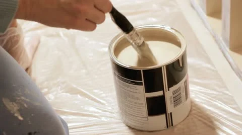 Dipping paintbrush Stock Footage 12626994