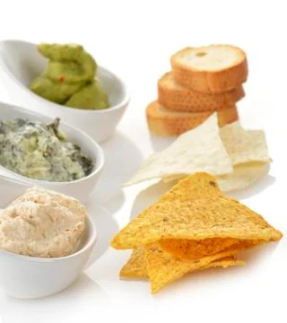 Dips with chips and toasts Stock Photos