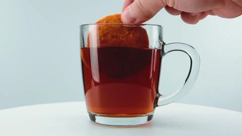 Dips cookies in tea. Close-up . Macro. Stock Footage 151153367