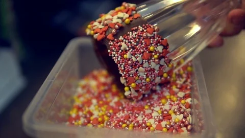 Dips the glass into a sweet sprinkle 스톡 동영상 86065955