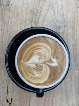 Direct above coffee latte on the table Stock Photos