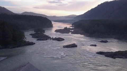 Direct aerial flight under rapid mountain river Katun and many islands. Altai. Video stock 84576175