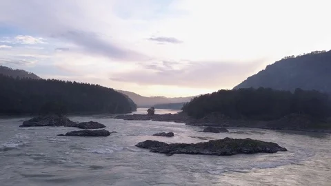 Direct aerial flight under rapid mountain river Katun and many islands. Altai. Stock Footage 84594507