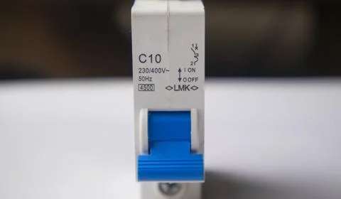 Direct, front-facing close-up shot of a white C10 miniature circuit breaker.. Stock Photos