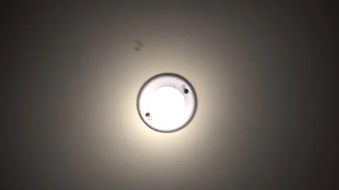 Direct Overhead Shot Of Basement Light Rumbling Around During Earthquake Stock Footage 247419103