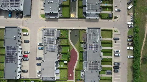 Direct overhead view of modern residential buildings with solar panels, private Video stock 323254904