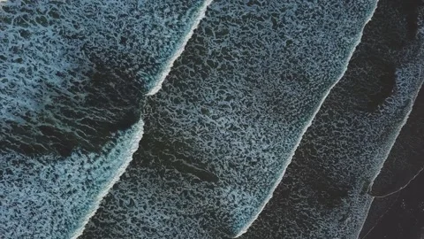 Direct Overhead Wave patterns on beach Stock Footage 137166405