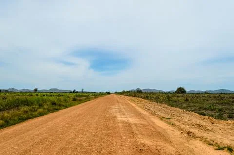 A direct road in the plains Stock Photos