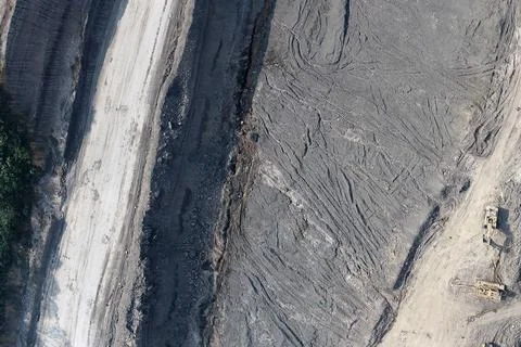 Direct top-down aerial view of an industrial mining site and earthwork terr.. Stock Photos