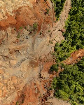 Direct top-down aerial view of a degraded land boundary showing the sharp t.. Stock Photos