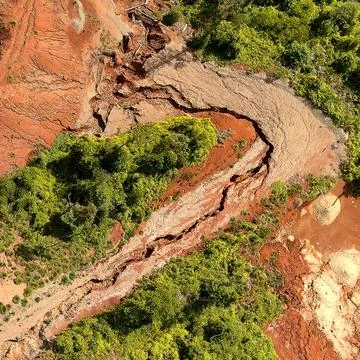 Direct top-down aerial view of a severe landslide scar and soil fracture sl.. Stock Photos