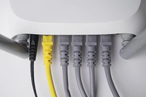 Direct top-down close-up of a white wireless router back panel, featuring a.. Stock Photos