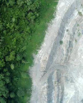 Direct top-down vertical aerial view of a dense tropical forest margin cont.. Stock Photos