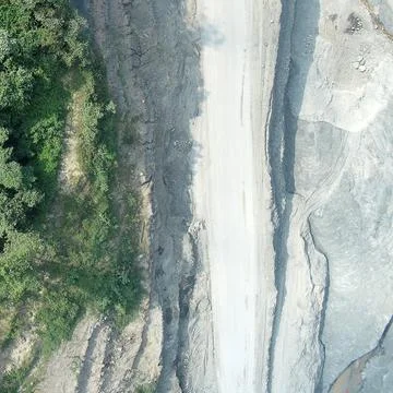 Direct top-down vertical aerial view of an industrial mining haul road corr.. Stock Photos